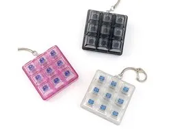 3 Stuks Keyboard Fidget Toy - Mechanische Toetsenbord Switch Tester - 9-Key Fidget Clicker - 6.2 x 6.2 cm - Sleutelhanger voor Stressverlichting - Transparante Keycaps & Blauwe Switches - Roze, Zwart & Helder